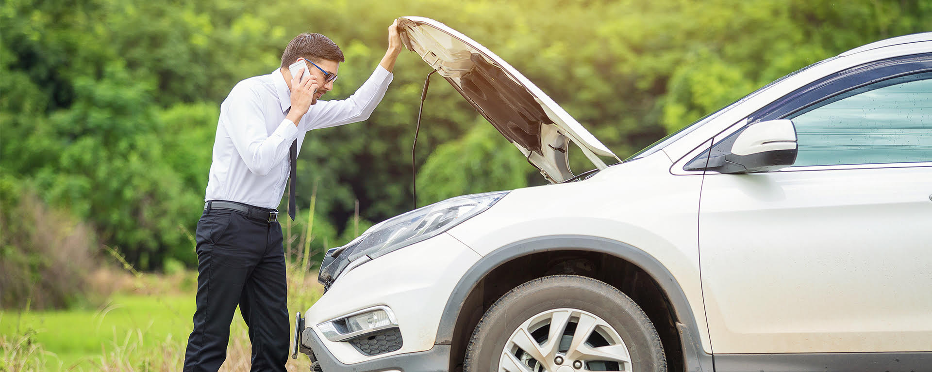 A couple smiling and reviewing a piece of paper