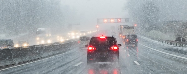 A couple smiling and reviewing a piece of paper