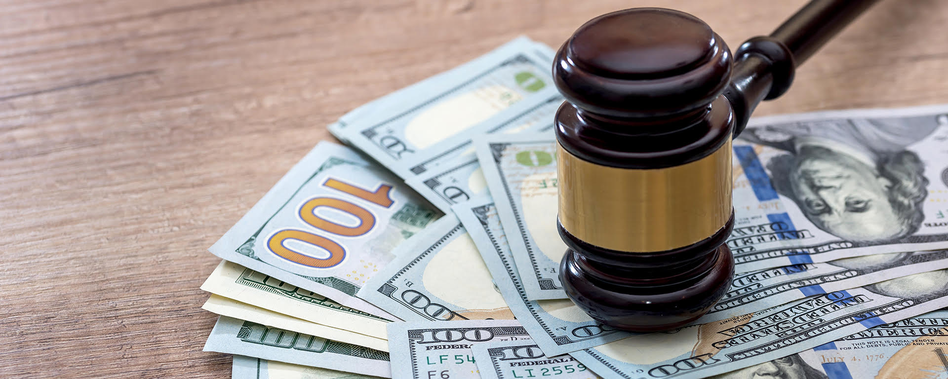 A couple smiling and reviewing a piece of paper