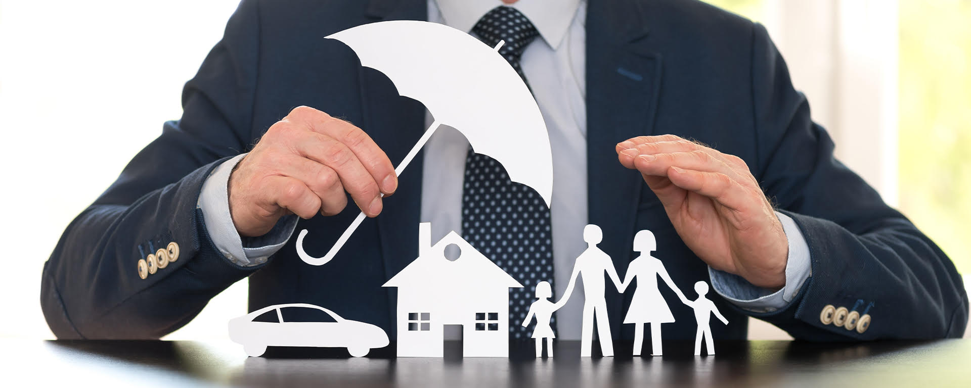 A couple smiling and reviewing a piece of paper